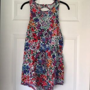 Adorable floral romper. Never worn. Tags attached.